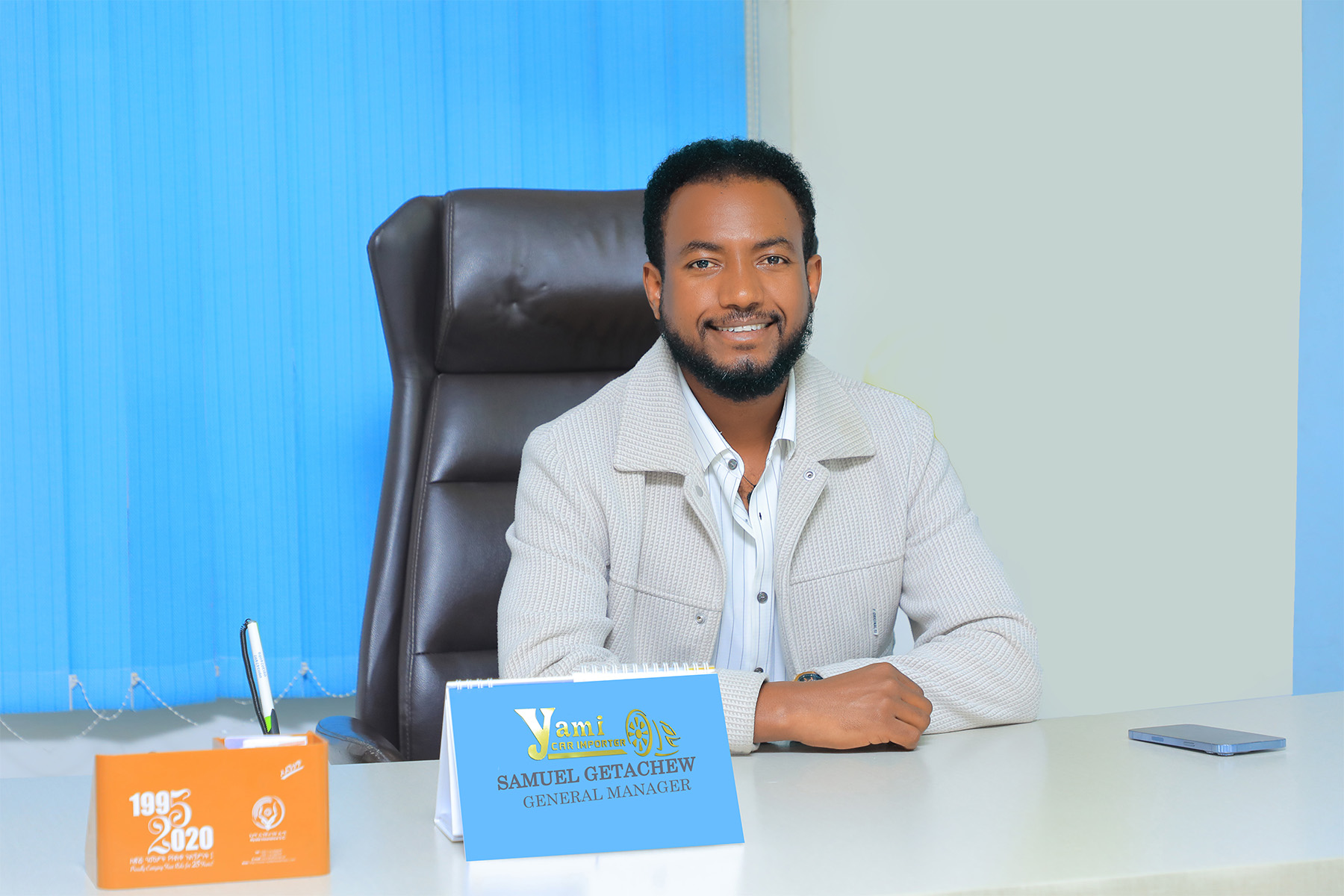 Samuel Getachew - General Manager of Yami Car Importer in his office